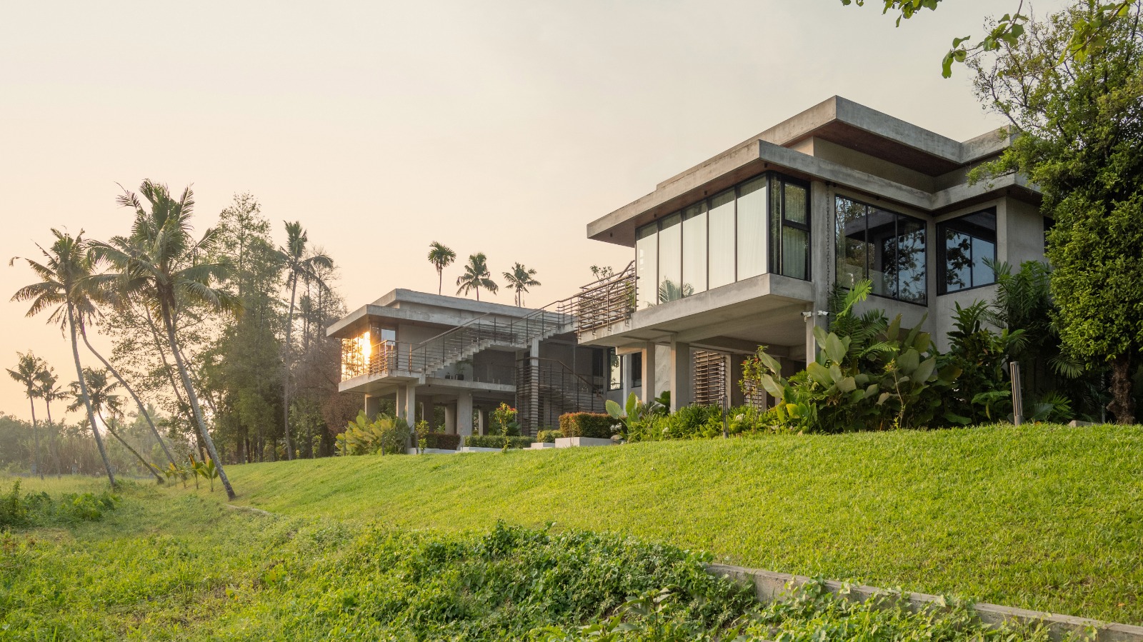 Sovnear estate exterior bathed in warm golden hour light